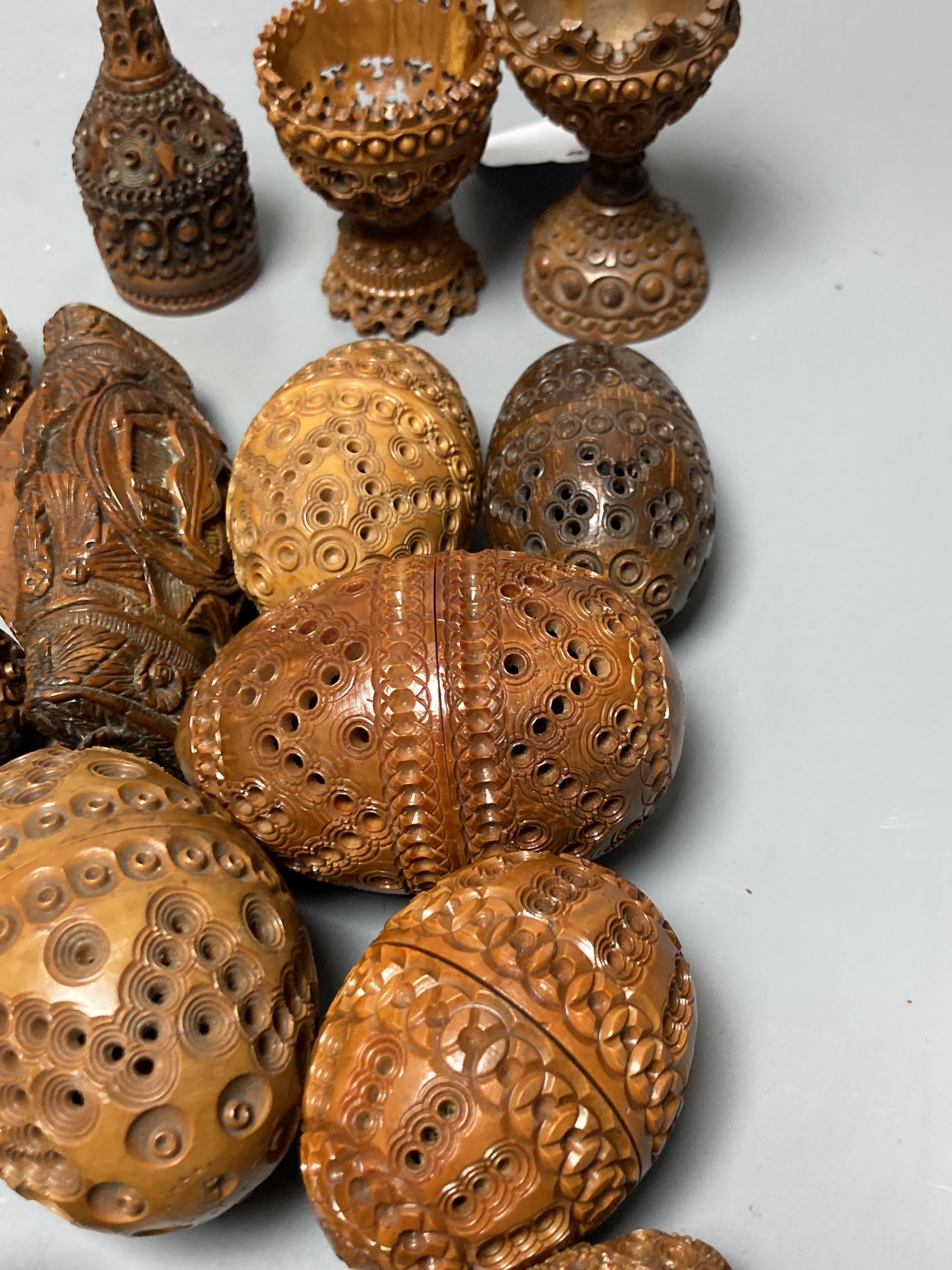 A quantity of coquilla nut carvings